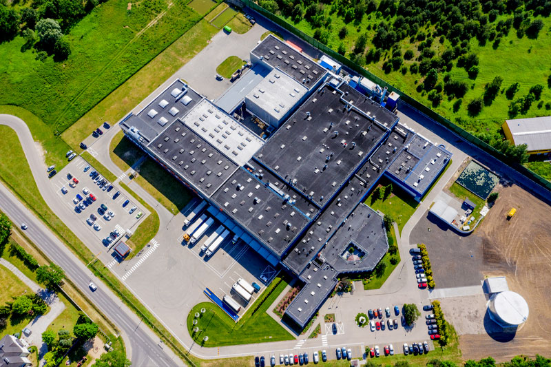 An drone shot aerial view of a building with a parking lot captured by Nashville Corporate Media